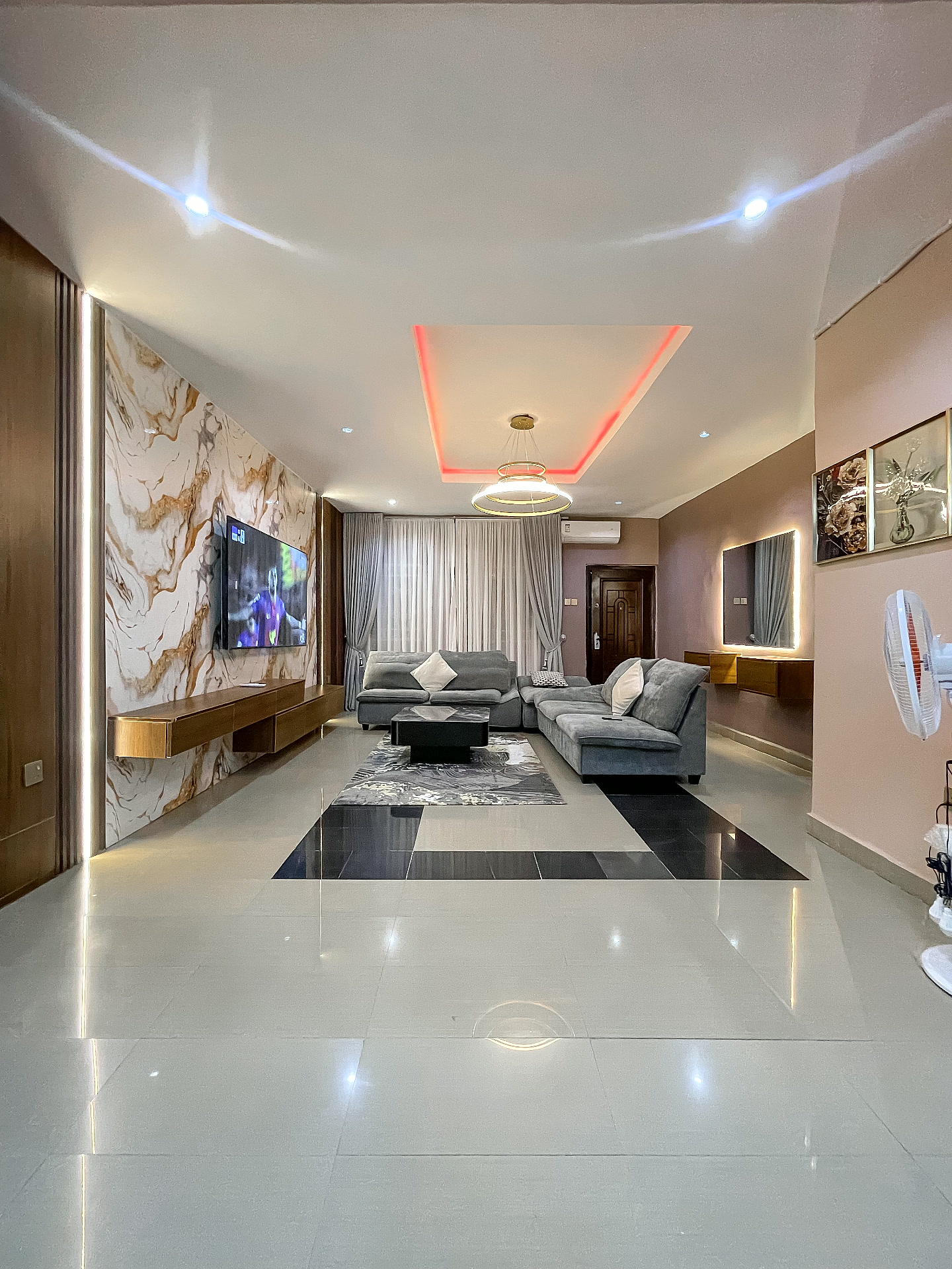 Sunlit living room interior at Omas Shortlet Apartments, Gwarinpa Abuja